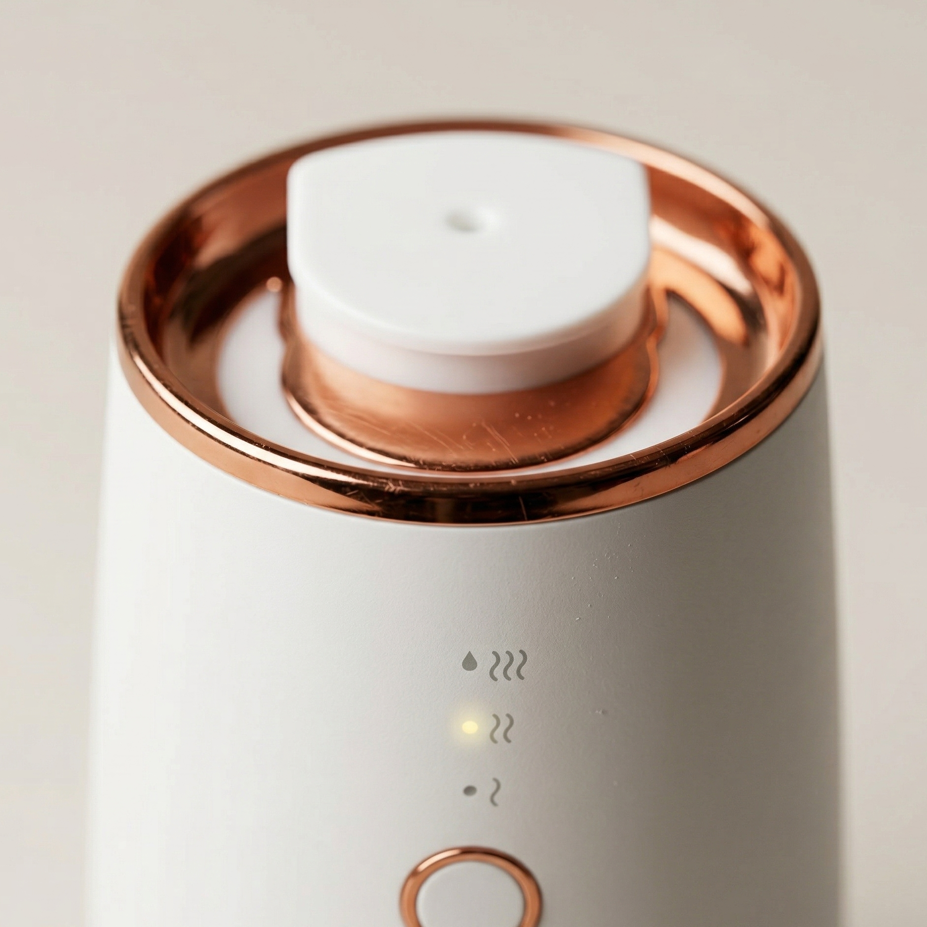Close-up of Aura One ultrasonic diffuser mist output in low light